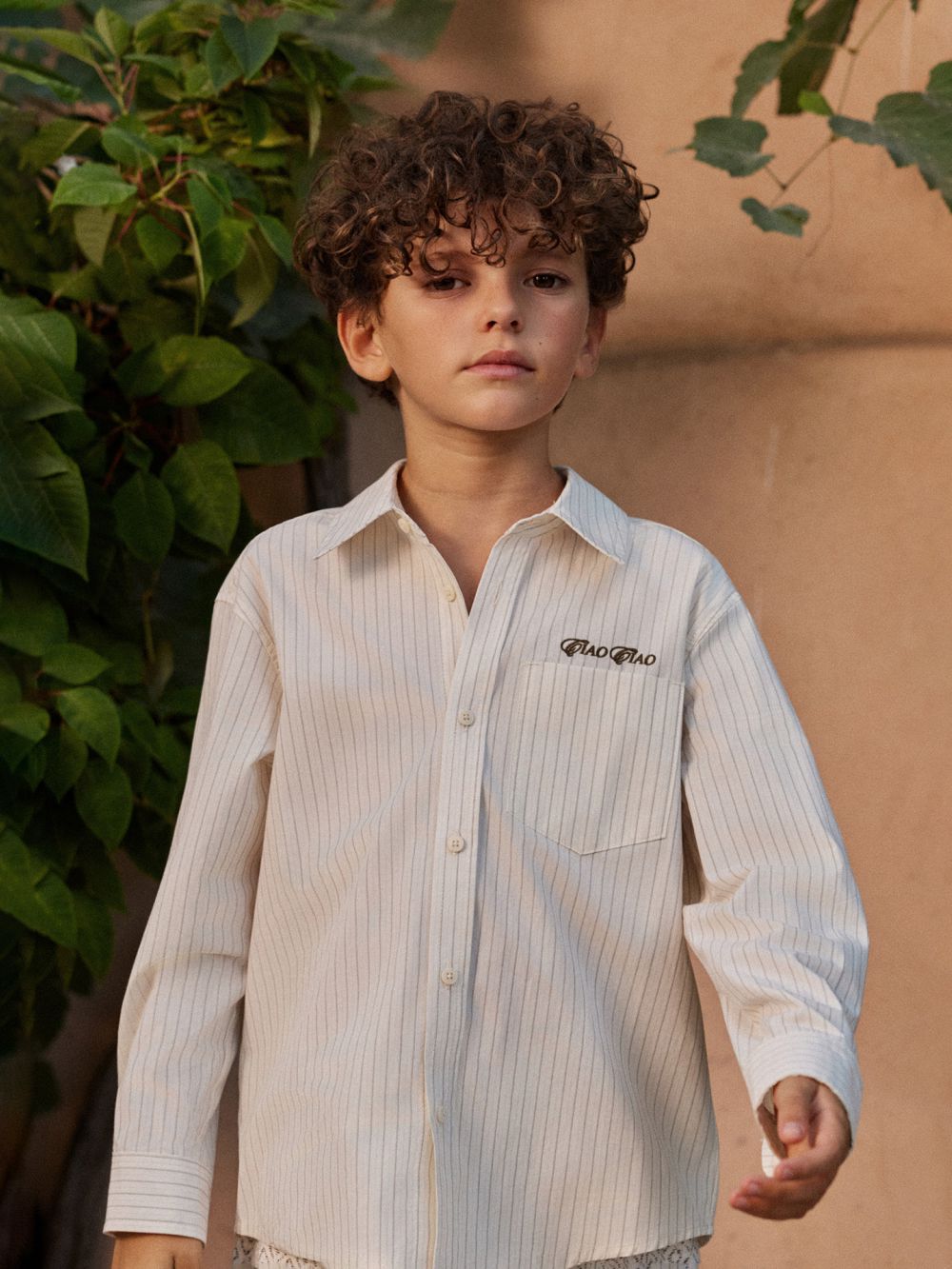 מכופתרת פסים